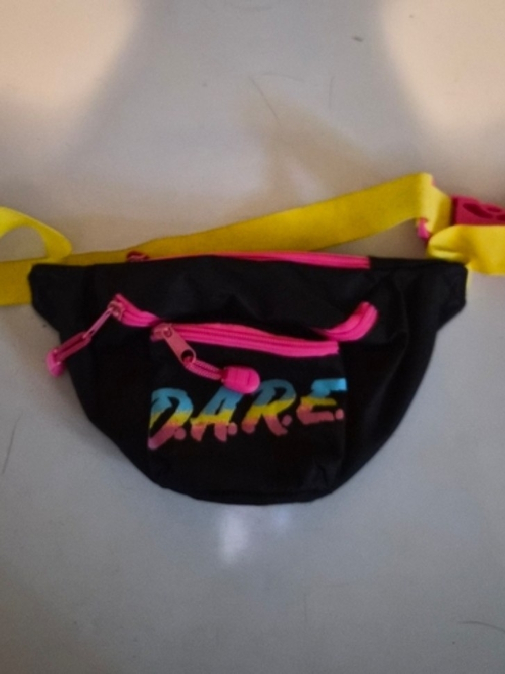Tipsy Elves Black Crossbody Fanny Pack with Hot Pink Zippers and Yellow Strap